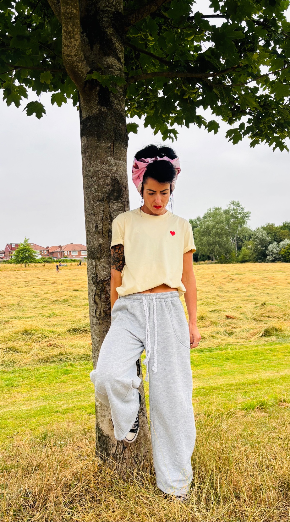 Bottoms Up Darlings tee front with small red heart print