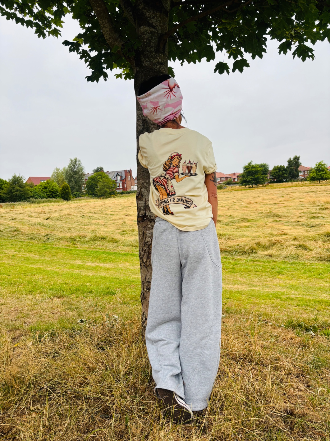 Bottoms Up Darlings tee back with diner pin-up artwork