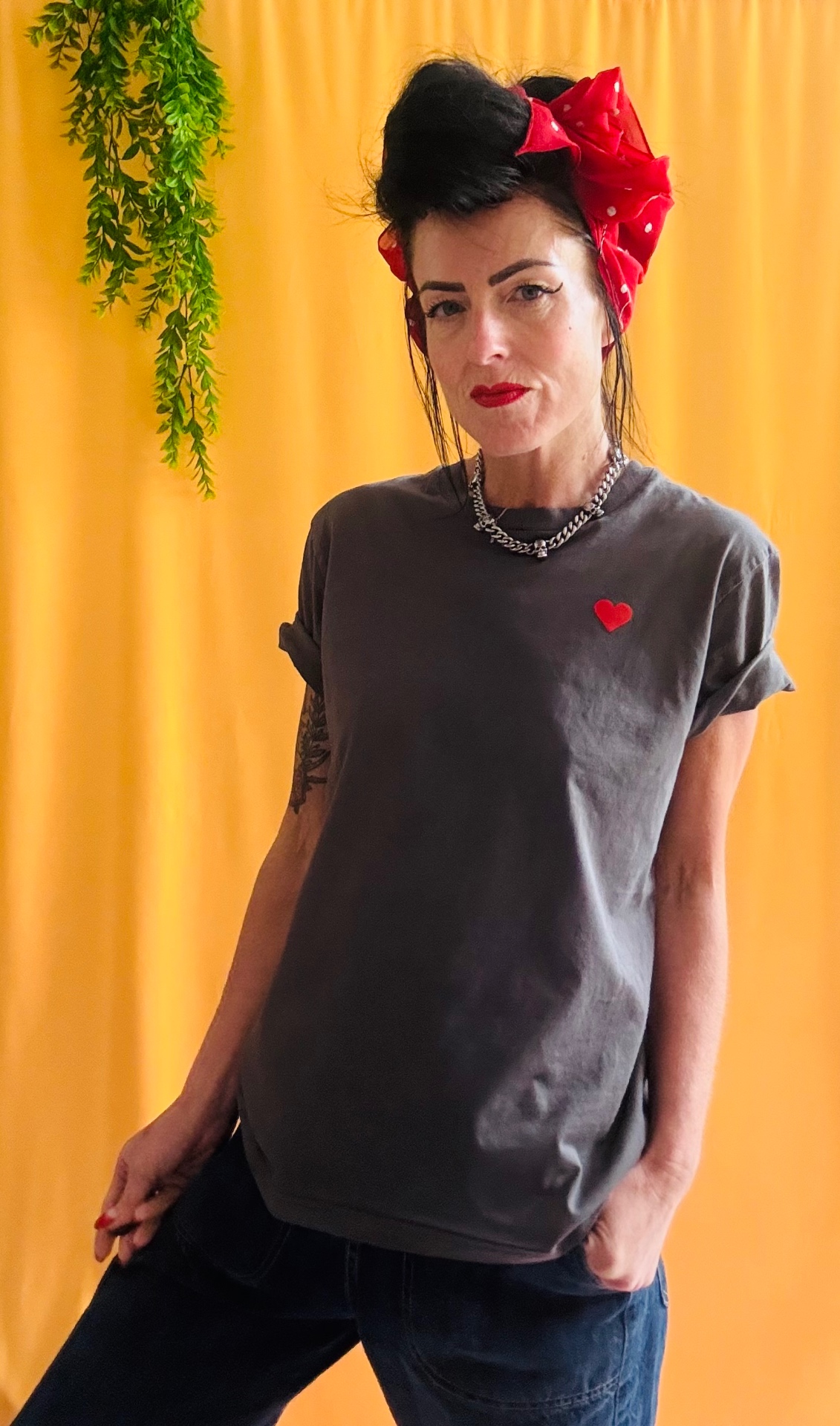 Bottoms Up Darlings tee front with red bandana and small heart print on yellow backdrop